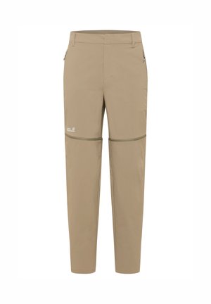 Beige wandelbroek voor dames die om te toveren is tot korte broek met afritsbare pijpen, een voorrits, zijzakken en een klein logo op het linkerdijbeen.