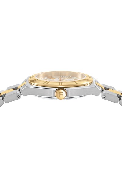 Silver and gold-tone wristwatch with a round case, textured circular dial, Roman numerals, and logo accent on the crown. Metal band links.