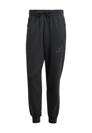 Black sweatpants with an elastic waistband, drawstring closure, side zip pockets, and a discreet logo printed on the left thigh.