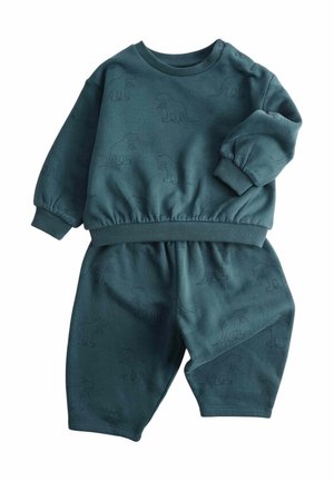 Mørkegrønblå (teal) sæt til småbørn med sweatshirt og bukser, med ribstrikkede manchetter og et diskret dinosaurmønster over hele stoffet.