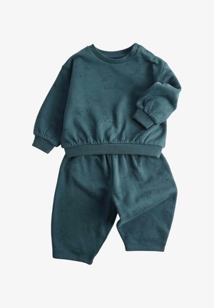 Mørkegrønblå (teal) sæt til småbørn med sweatshirt og bukser, med ribstrikkede manchetter og et diskret dinosaurmønster over hele stoffet.