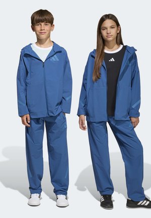 adidas Originals, Z.N.E. WOVEN TRAVEL PANTS UNISEX - Broek - dusky petrol dusky ink