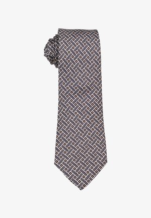 Zijden stropdas met een geometrisch patroon van elkaar kruisende zwarte en beige lijnen die diamantvormen vormen op een lichte achtergrond.