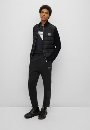 DREVITALIS - Verryttelyhousut - black