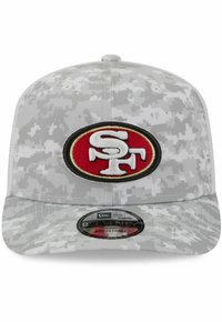 Gray cap featuring a digital camouflage pattern, with a circular red, black, and white embroidered SF logo on the front. Adjustable fit.