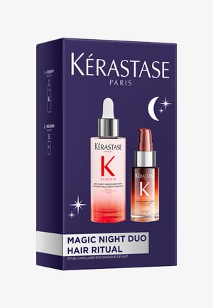 Boîte Kérastase Magic Night Duo Hair Ritual montrant deux flacons de sérum pour le soin des cheveux de nuit sur un fond violet foncé avec lune et étoiles.
