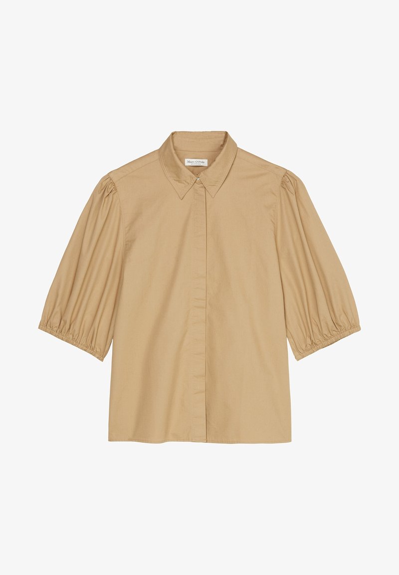 Blouse beige à manches courtes avec manches bouffantes, col pointu et boutons avant dissimulés, posée à plat sur fond blanc.