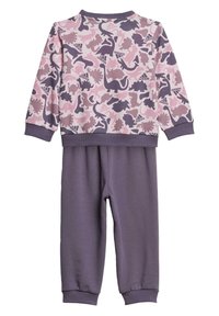 Pantalons de survêtement violets avec un haut à manches longues rose assorti, présentant un motif de dinosaure. Fabriqué en tissu doux avec des poignets et un col à côtes.