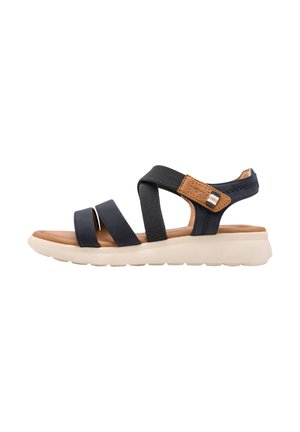 Sandalia abierta en negro y marrón con dos tiras delanteras, una correa ajustable en el tobillo y una suela beige acolchada.