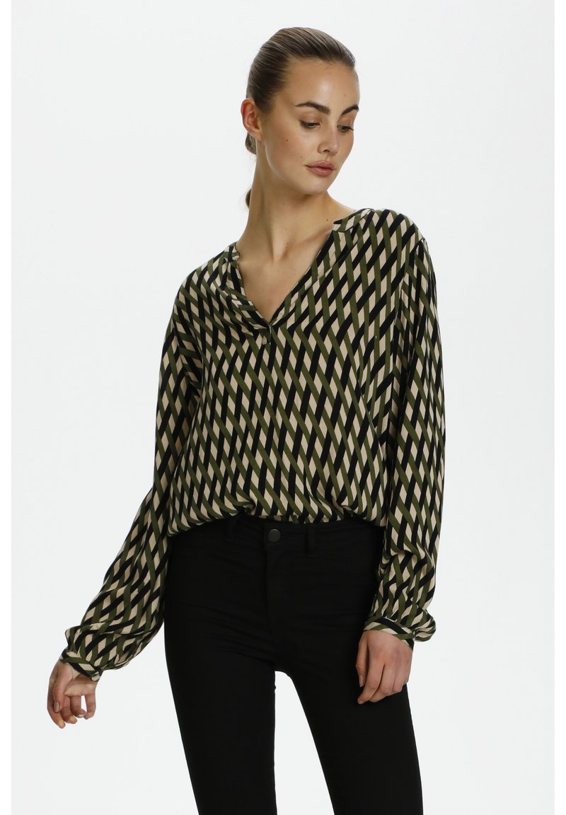 Langärmlige Bluse mit einem grünen, beigen und schwarzen Diamant-Muster. Glattes, leichtes Gewebe mit V-Ausschnitt und lockerer Passform.