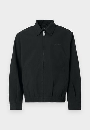 Črna jakna z zadrgo spredaj z metalnim potegom, klasičnim ovratnikom, elastičnim robom in stranskimi žepi. Izdelana iz gladkega blaga.