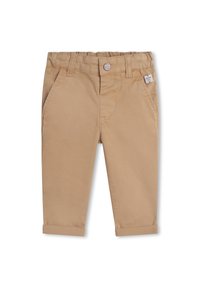 Pantaloni in cotone beige con design a gamba dritta, dotati di orlo arrotolato, tasche laterali e una piccola etichetta con logo vicino alla vita.
