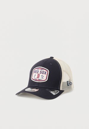 Navy and white mesh baseball cap with Boston Red Sox logo patch and adjustable snapback closure on plain background.