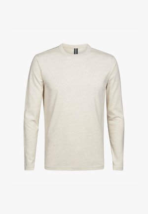 T-shirt z długim rękawem w jasnym beżu, wykonany z miękkiej bawełny. Posiada okrągły dekolt oraz minimalistyczny design bez wzorów i akcentów.