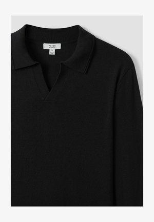Sort strikket sweater med V-hals og kort krave. Fremstillet af blødt materiale, med en glat tekstur og minimalistisk design.