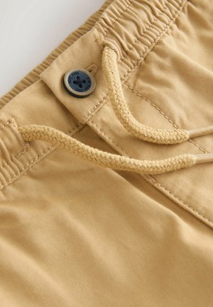 Khaki-Shorts mit elastischem Bund, verstellbarem Kordelzug und Knopfverschluss. Glattes Material mit subtiler Textur.