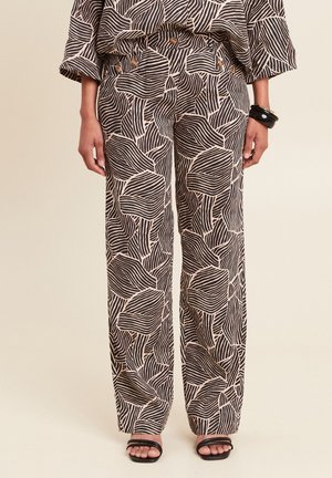Weit geschnittene Hosen mit einem schwarz-cremefarbenen Wellenmuster, aus glattem Stoff gefertigt, mit seitlichen Taschen und einem taillierten Bund.