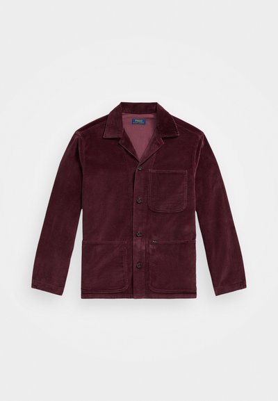 Burgundy corduroy jacket with a notched collar, front button closure, chest pocket, and two lower pockets. Smooth texture with visible ribbing.