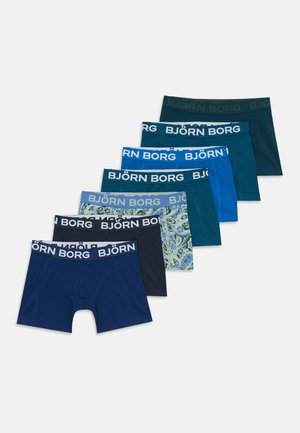 Seven pairs of folded men's boxer briefs in varying blue tones and patterns with "BJÖRN BORG" branded waistbands displayed on white.