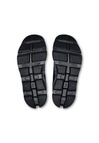 Schwarze Sportschuhsohlen mit strukturierten Mustern und Rillen für den Halt. Verfügt über ein segmentiertes Design für Flexibilität und Stabilität.