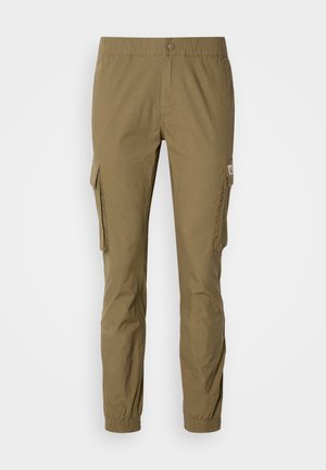 Cargo pants in olive green, featuring an elastic waistband, side pockets, and tapered legs with elastic cuffs. Made from durable fabric.