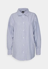 Sininen ja valkoinen raidallinen nappipaita, pitkät hihat, klassinen kaulus ja normaali istuvuus. Puuvillasekoitemateriaali, jossa on sileä pinta.