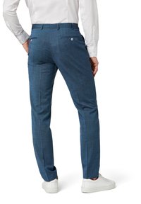 Blue checkered trousers made of textured fabric, featuring a slim fit, two back pockets, and a smooth waist with belt loops, paired with white sneakers.