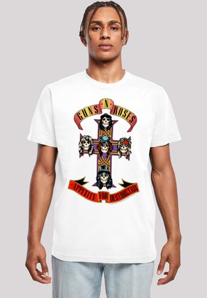 White cotton t-shirt featuring a colorful graphic of a skull design with a cross, topped with a ribbon that reads "Guns N' Roses - Appetite for Destruction."