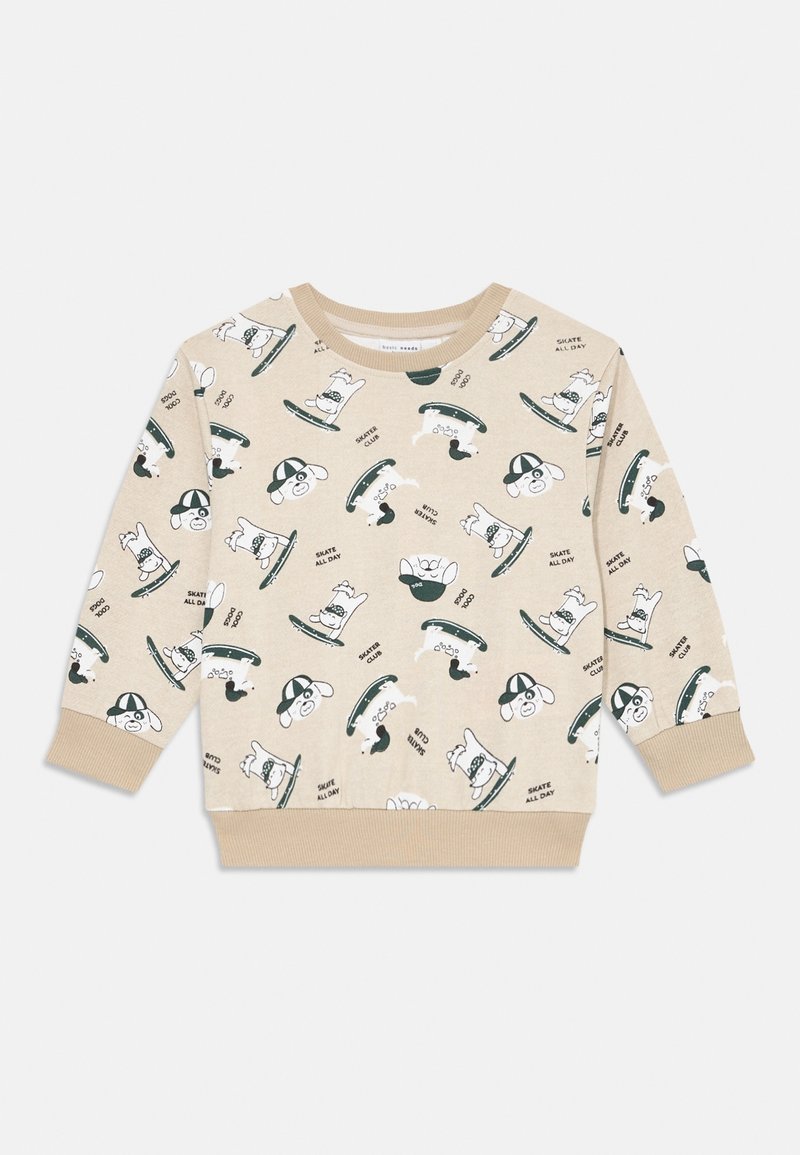 Sweat-shirt beige à manches longues pour tout-petits avec motif répété de chien noir et blanc en skateboard et texte "Skate All Day".