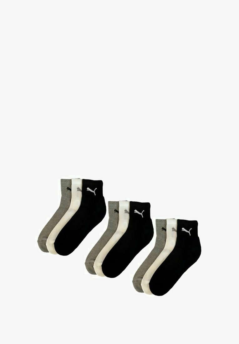 Three sets of ankle-length Puma socks in gray, white, and black, each pair arranged side by side with logo visible on the ankle cuff.