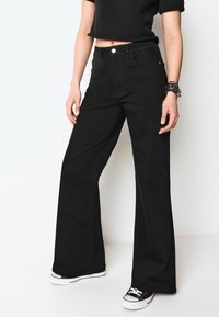 Next WIDE LEG  - Flared jeans - black