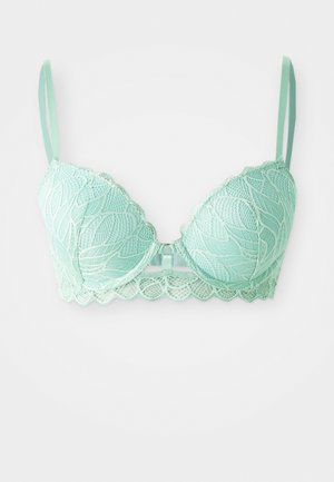 Mint green lace bra with underwire, scalloped edges, decorative leaf patterns, adjustable straps, and a central clasp detail.