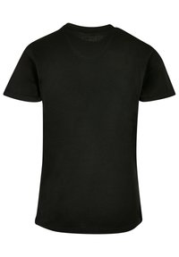 Black cotton t-shirt, short sleeves, round neckline, standard fit, smooth texture, no visible branding or patterns, plain back view.