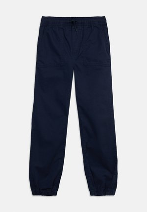 Marineblaue Freizeithose mit elastischem Bund, verstellbarem Kordelzug, aufgesetzten Fronttaschen und elastischen Bündchen an den Knöcheln.