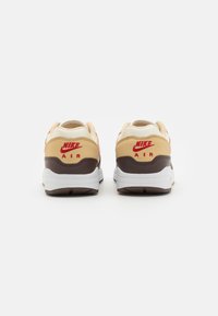 Nike Sportswear W NIKE AIR MAX 1 87 VDAY - Športni copati - sesame/med soft pink/coconut milk/baroque brown/gym red/white