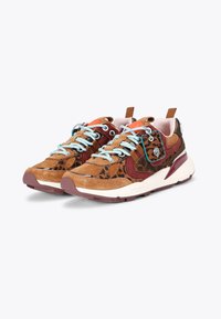 Chunky sneakers with leopard print, brown suede, maroon panels, light blue laces, and a decorative tag on a white and maroon sole.