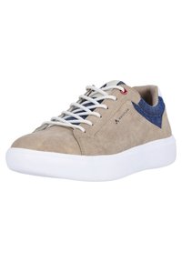 Beige suede sneaker with white rubber sole, blue denim accent, and gray laces. Features a stitched design and logo on the side.