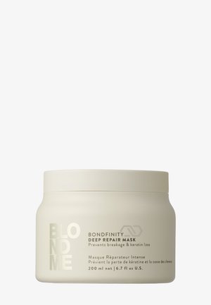 Masque de réparation profonde Blondme Bondfinity dans un pot blanc opaque avec un couvercle à vis ; capacité de 200 ml ; lettrage argenté sur l'étiquette.