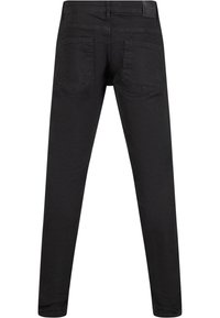 Jeans de mezclilla negra con corte ajustado, que cuentan con dos bolsillos traseros y un diseño simple. La textura suave y las líneas limpias son detalles notables.