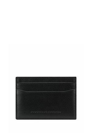 Porte-cartes en cuir noir avec trois emplacements pour cartes et logo "Porsche Design" embossé discret sur le devant.