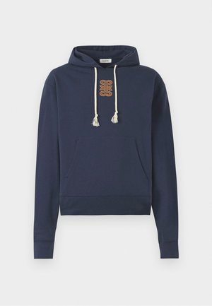 Navy blue hoodie made of cotton, featuring a front pocket, drawstring hood with tassels, and a tan embroidered logo on the chest.