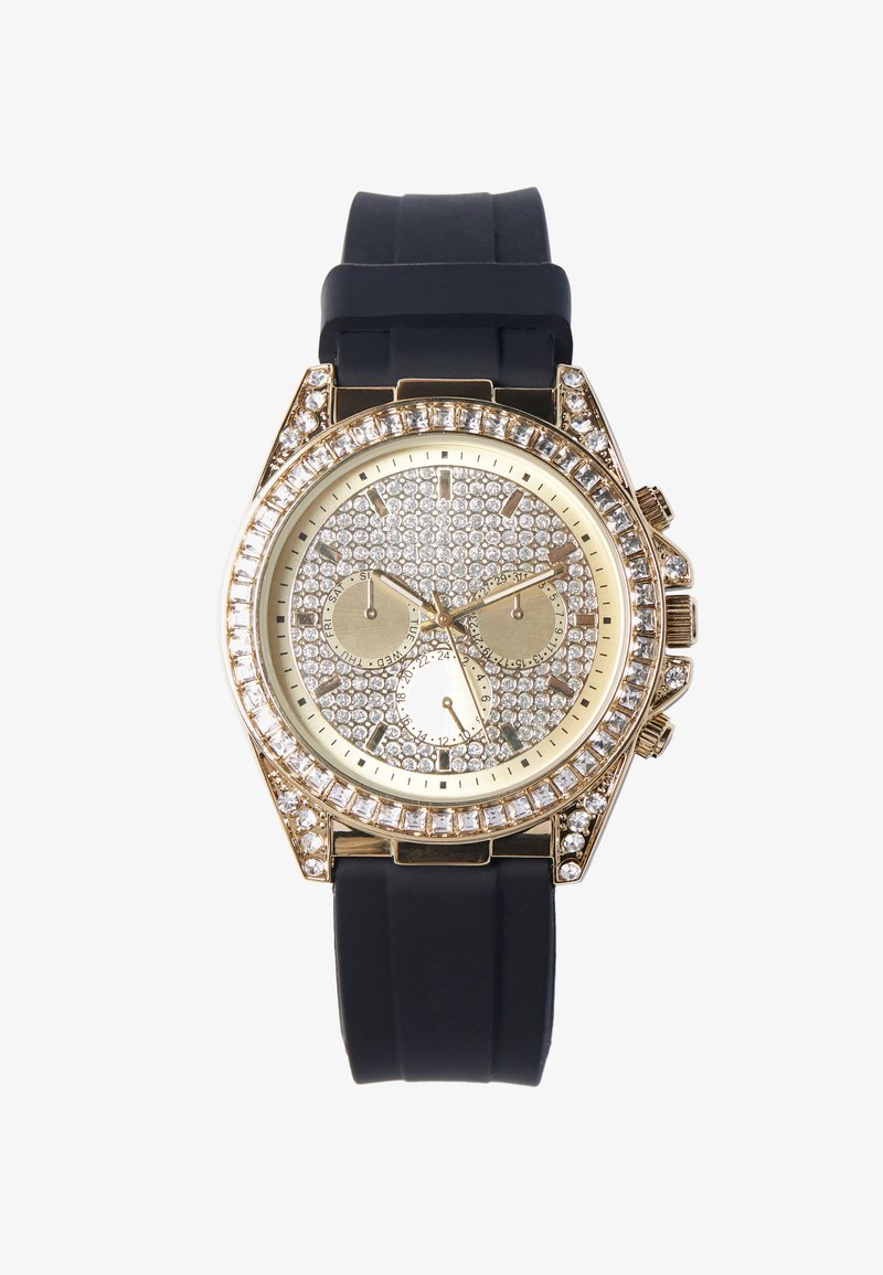Gold-tone watch with a textured silver face encrusted with crystals, featuring a black rubber strap and three sub-dials for functions.
