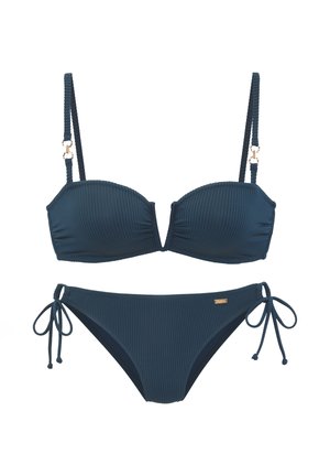 Dark blue ribbed two-piece bikini with adjustable shoulder straps, underwire cups, and side tie closure on the bikini bottom.