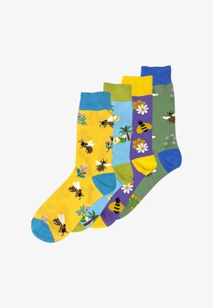 Vier paren katoenen sokken in liviige kleuren: geel, blauw, groen en paars. Met bijen- en bloemenpatronen. Tot aan de knie gesneden.