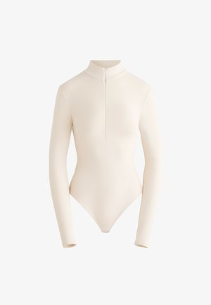 Long-sleeve bodysuit in light beige fabric with a high collar and front zipper, featuring a smooth, fitted design and a low-cut back.