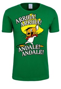 Green cotton t-shirt featuring a cartoon character with a large yellow sombrero. Text reads "ARRIBA! ARRIBA! ANDALE! ANDALE!" in bold black font.