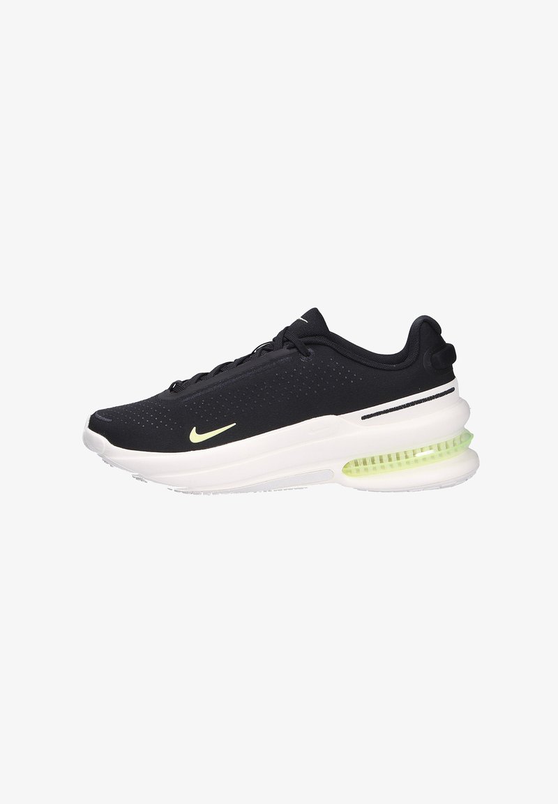 Bottine de course Nike en noir et blanc avec une semelle à coussin d'air vert clair et des lacets noirs, vue de côté sur fond blanc.