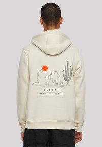 Cream-colored hoodie featuring a graphic design of mountains, a sun, and a cactus on the back. Soft texture, drawstring hood.