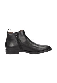 Bottine noire en cuir avec une fermeture éclair sur le côté, bout rond, texture lisse, petit talon empilé, et une bande à l'arrière pour un enfilage facile.