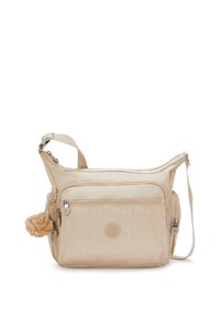 Borsa a tracolla beige con numerose tasche con zip, tracolla regolabile e un piccolo portachiavi a forma di scimmietta in peluche attaccato di lato.